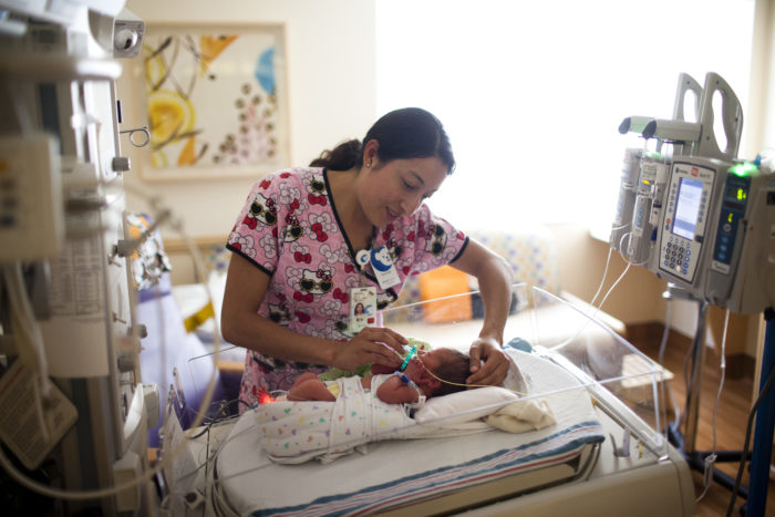NICU nurse cares for infant