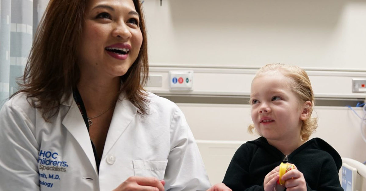 Dr. Van Huynh, pediatric oncologist at the Hyundai Cancer Institute at CHOC Children's, plays with a young patient