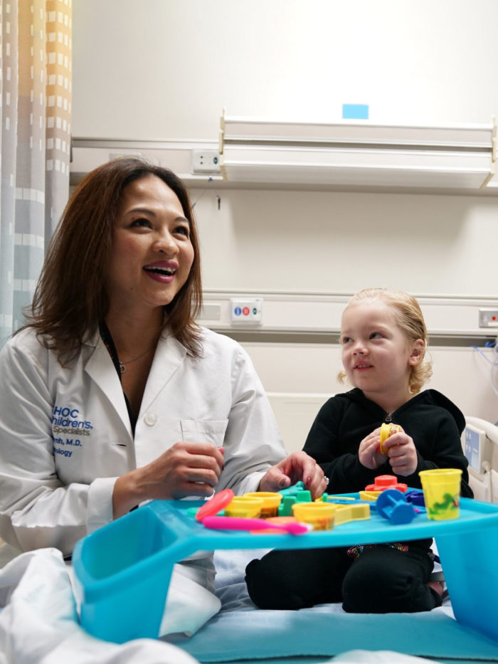 Dr. Van Huynh, pediatric oncologist at the Hyundai Cancer Institute at CHOC Children's, plays with a young patient
