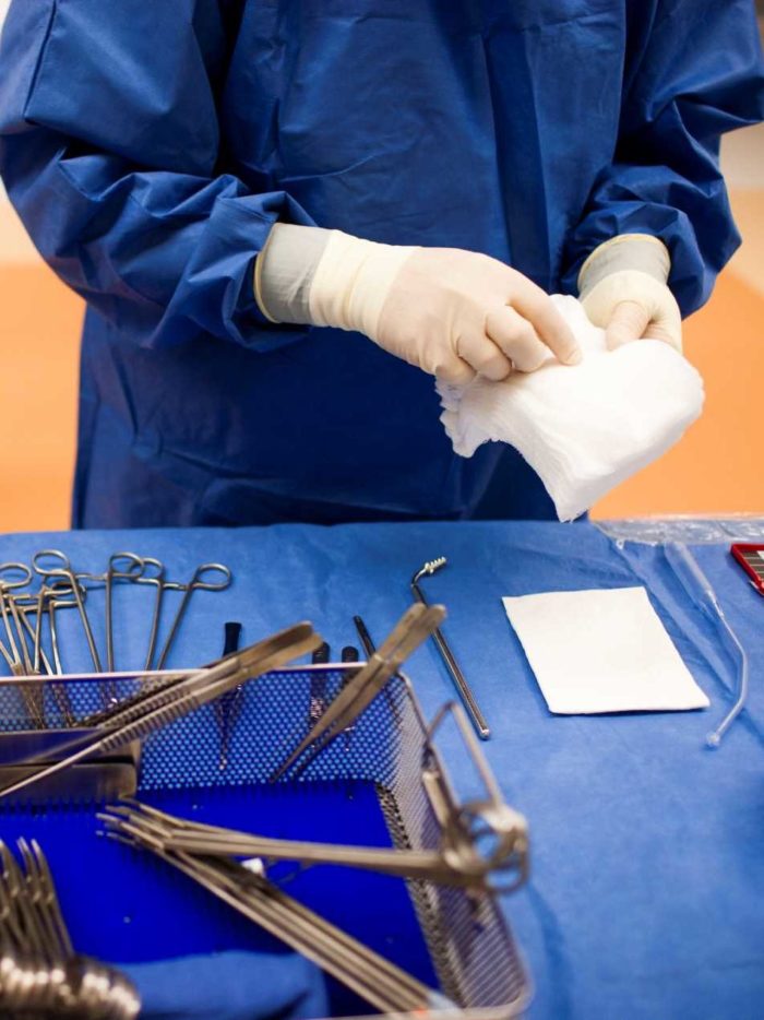 Surgeon preps surgical tools