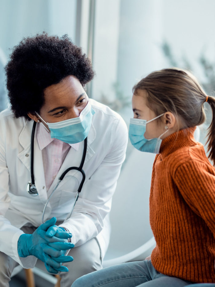 doctor talking to a small girl