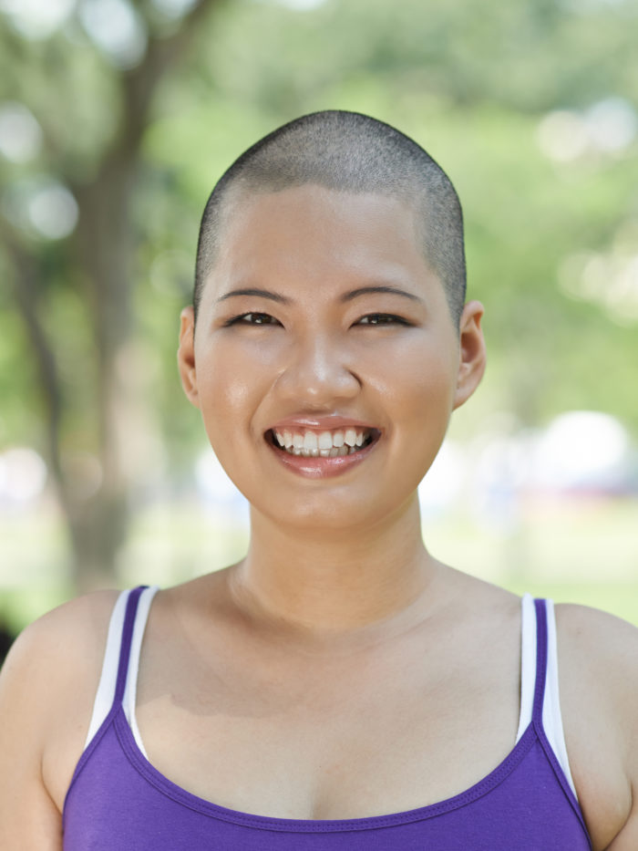 woman with short hair smiles for the camera