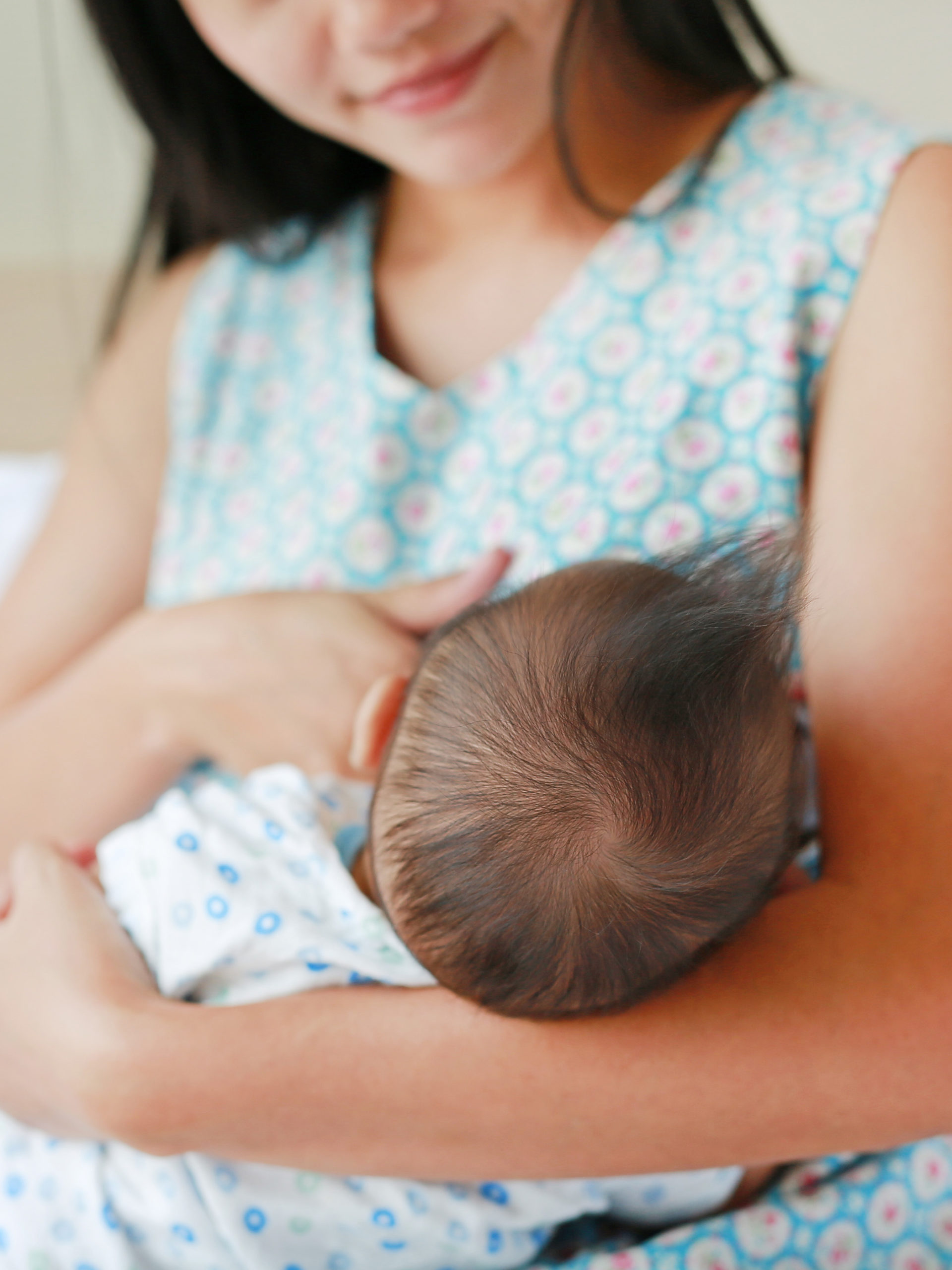 woman breastfeeds her baby