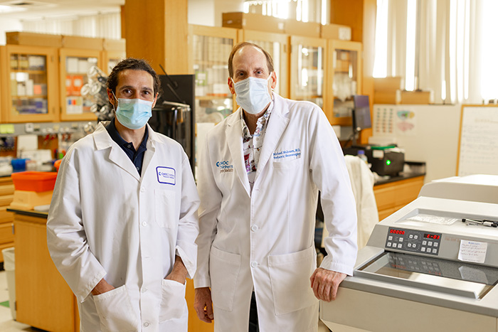 Dr. Castañeyra-Ruiz, senior scientist, and Dr. Muhonen, neurosurgeon