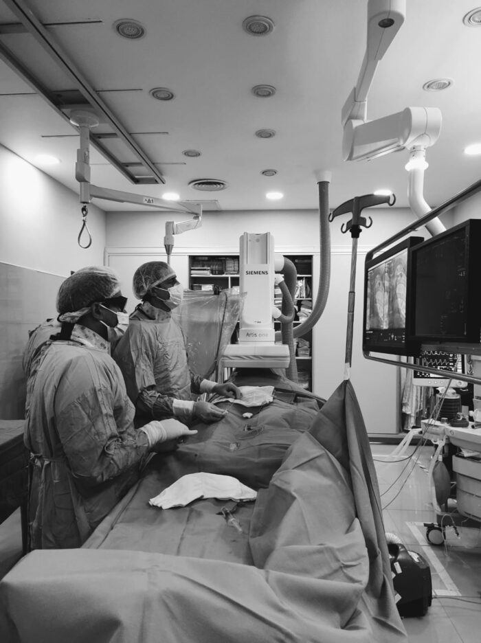 Drs. Sinha and Peirone during surgery