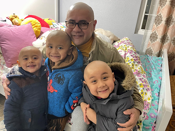 Lucas, Leo, Luis and Max, all with shaved heads 