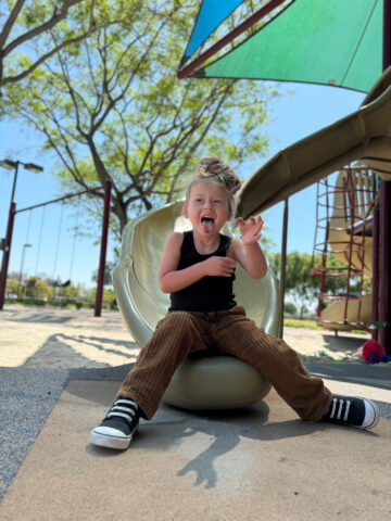 Girl smiles on playground