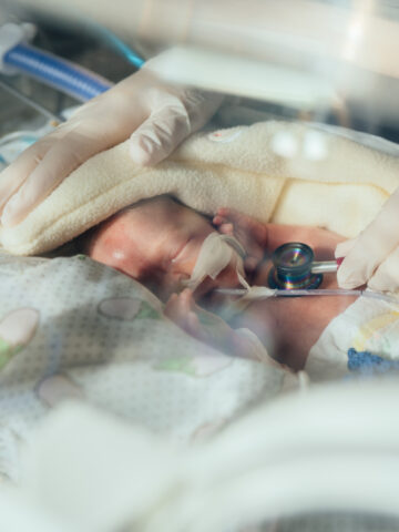 Nurse with baby in NICU