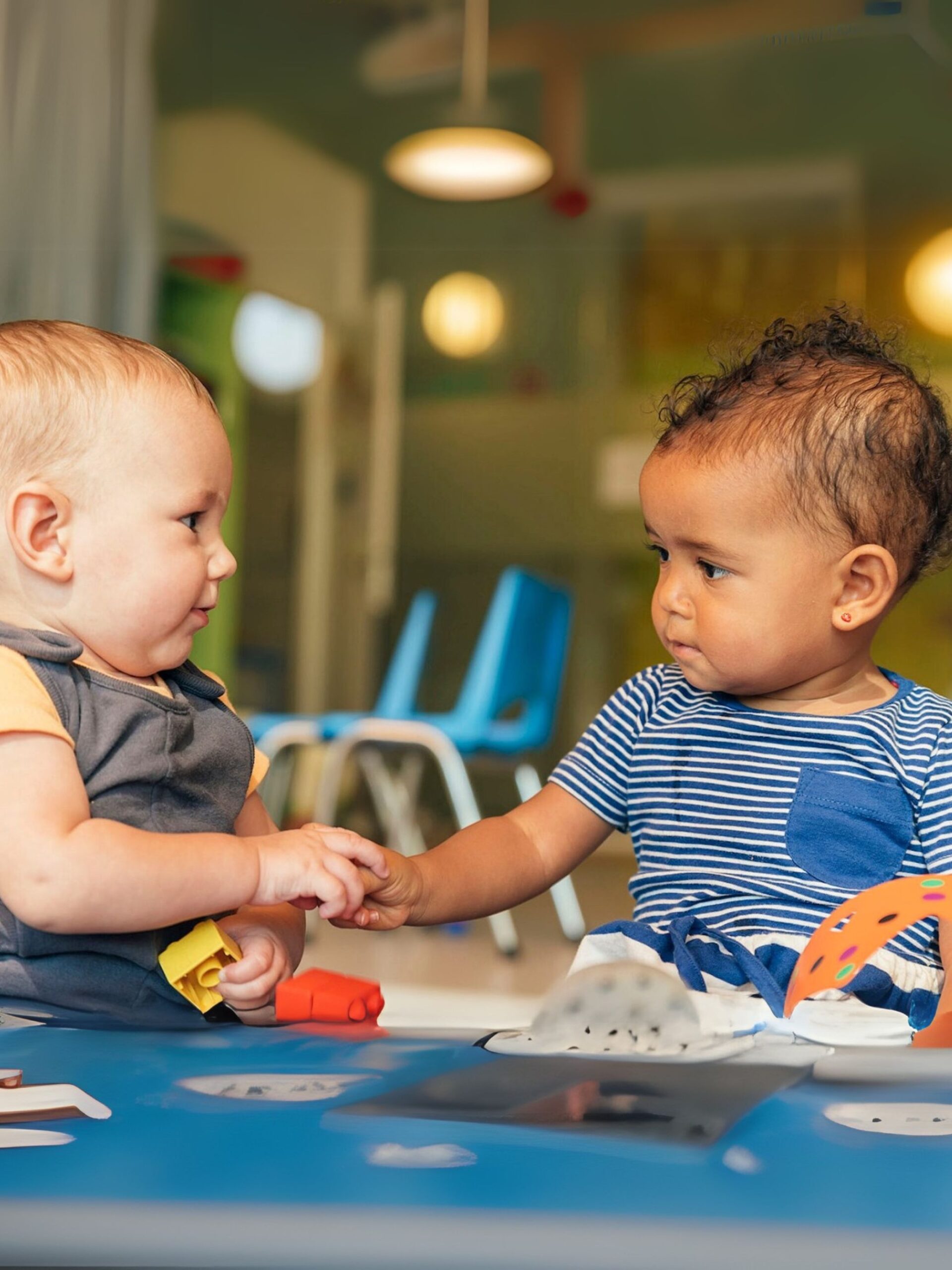 Two babies in a playroom at CHOC