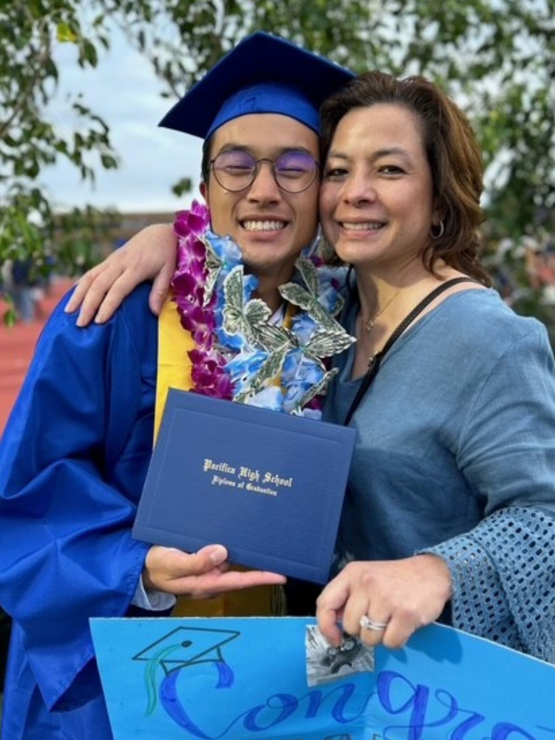 High school graduate Ethan Nguyen with his mother