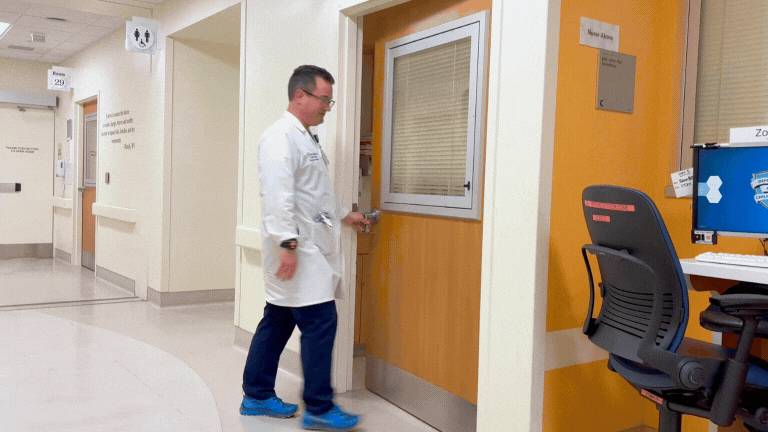Dr. Heyming entering a room in the emergency department at Rady Children's Health Orange County